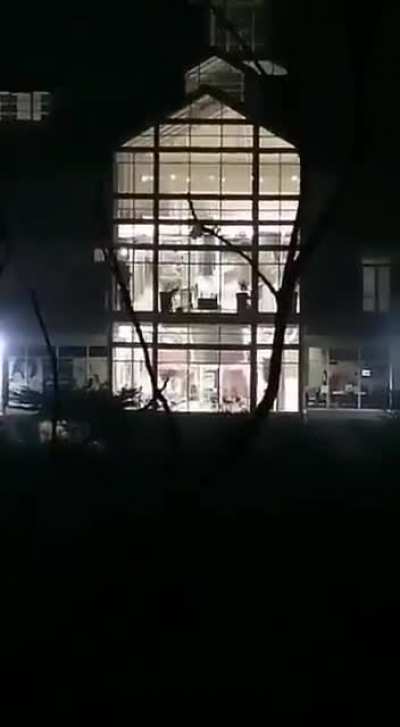 Looter falls from window