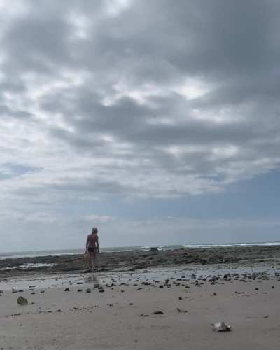 Emily Wickersham walking on beach
