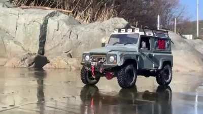 WCGW driving a Land Rover defender over a frozen lake