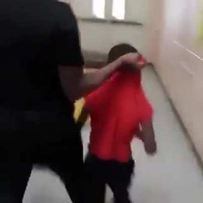 Woman gives her son a thorough beating at school after receiving a call from a teacher