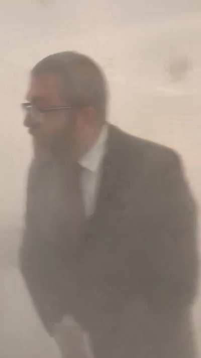 A Polish depute Grzegorz Braun extinguishes the Jewish menorah on Hanukkah inside the Polish Parliament 12.12.2023