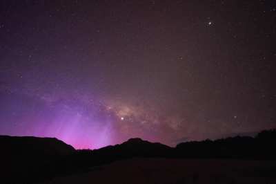 Went hiking in the mountains - set up a timelapse of the galactic core setting only to get an Aurora Australis surprise - taken from Arthur's Pass, New Zealand [OC] [Gif]