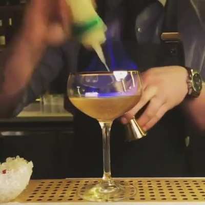 Just a bartender showing off… with fire.