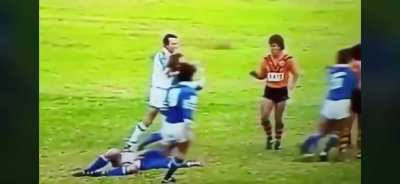 Allan MacMahon of Balmain hits a Newtown opponent with a cracking textbook rib-tickler in the early ‘80s