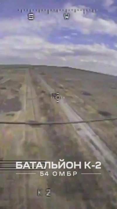 Ukrainian Kamikaze drone of the K-2 Battalion scores a headshot on a soldier riding in the tank