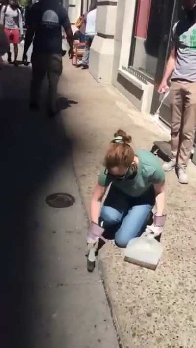 Protestors helping to clean up the riots