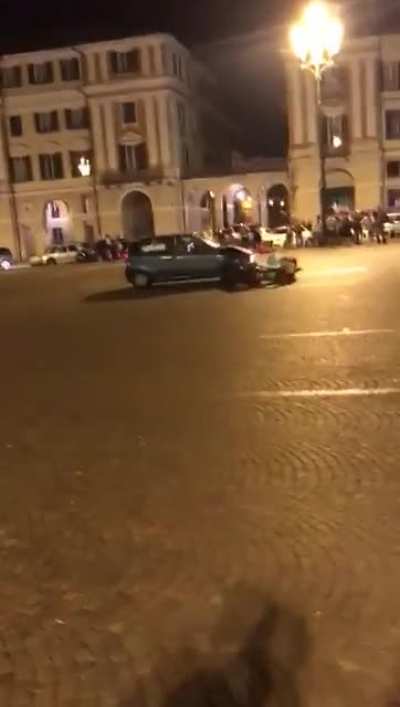 Incident in the city of Cuneo, during the celebration of Italy's victory. The 20 year old driving the scooter and the 14 year old girlfriend with him were severely injured but didn't die.