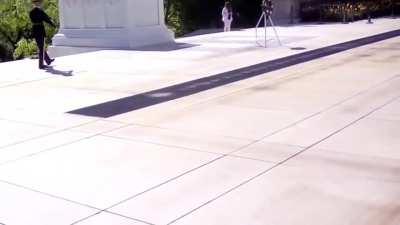 Woman visiting Arlington National Cemetery ignores the 