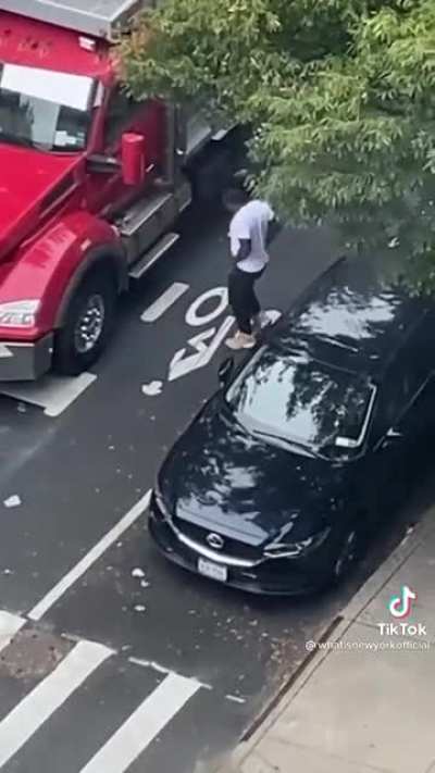 Trucker in New York City instantly regrets honking at someone who was slowly driving through an intersection