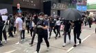 People in Hong Kong's financial district cheering for protesters' arrival