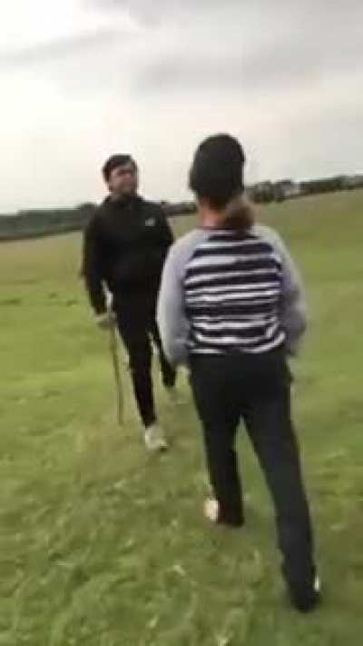 Woman racially abuses teenager, spits in his face and kicks his dog. Nobody does anything to help the young man