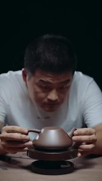 Man handcrafting a teapot [Unintentional]