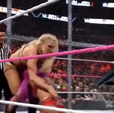 Sasha Banks having her bottoms turned in a thong as she takes a beating in front of millions