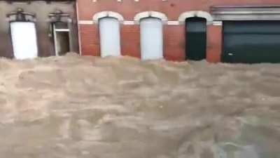 Pepinster: street turned into wild river.