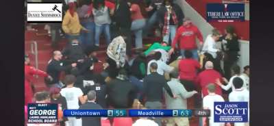 Fight breaks out in the stands of basketball game, chaos ensues