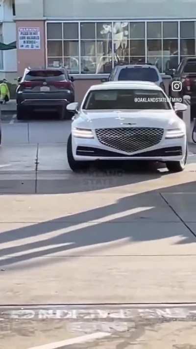 Thieves steal luggage from a car trunk while as the owner pumps gas at a gas station in Oakland, California