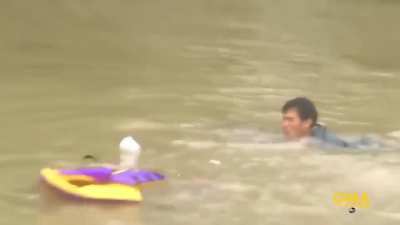 Man Saves Woman, Dog Seconds Before Car Sinks