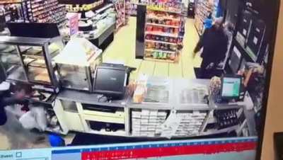 2 idiots jump the counter and attempt to rob a 7-11 with a fake gun. Badass security guard sneaks in front door and shoots them both. One robber yells 