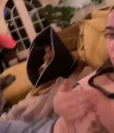 Slapping her tits