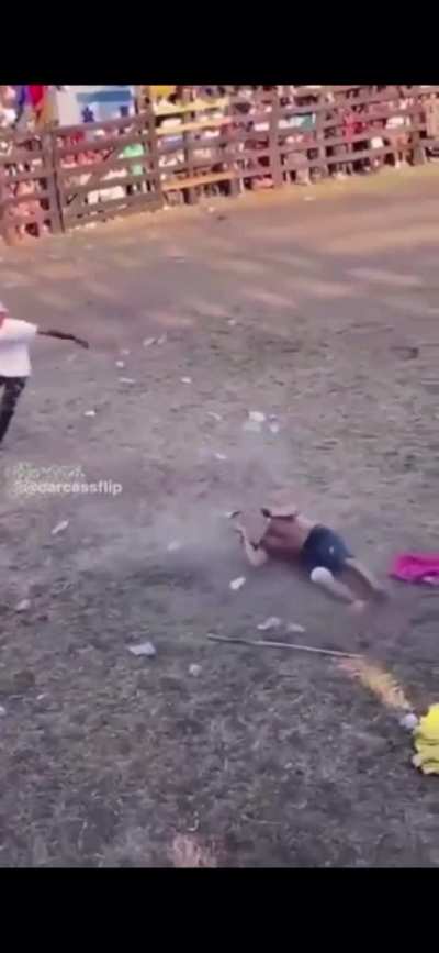 A person attempts to backflip over a bull