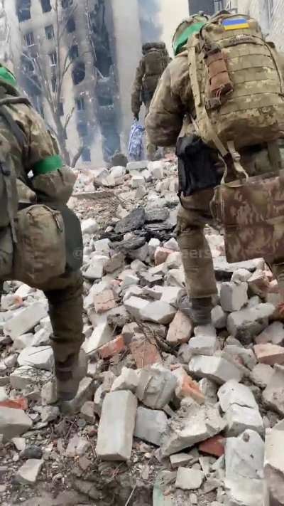 Ukrainian soldiers move through Bakhmut