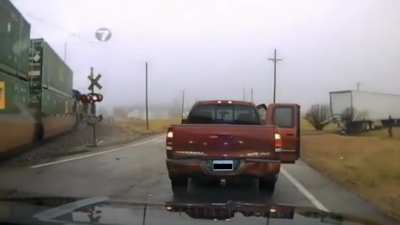 Truck hit by train runs over cop, Cop survives