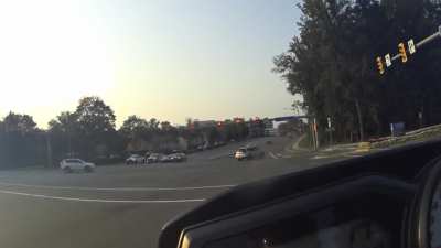 Failed a left turn, hit two curbs.