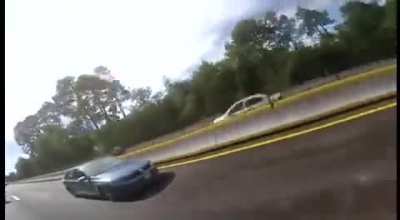 Biker VS Car road rage incident results in hectic car crash.