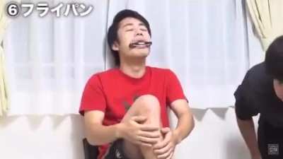Hitting one’s leg with a harmonica in their mouth