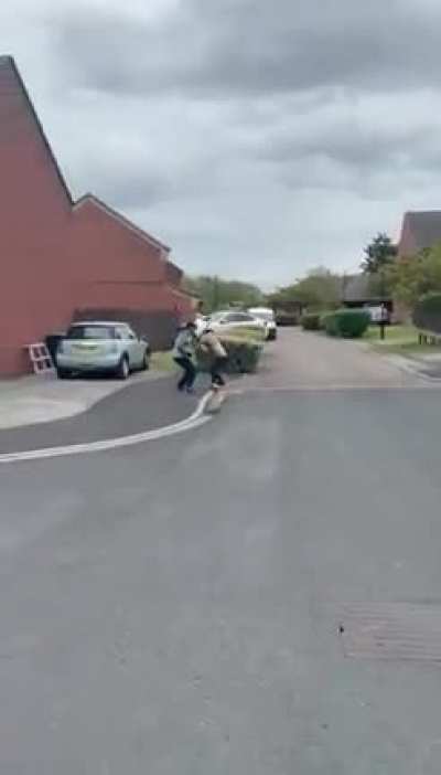 Two men fight in the street with knives