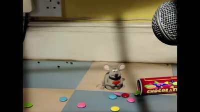 Just a rat peacefully eating an m&m