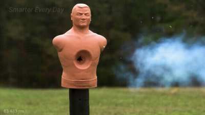 SmarterEveryDay shoots supersonic baseball THROUGH boxing dummy (YT source in comments)
