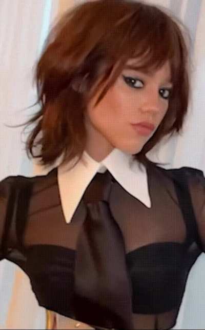 Jenna Ortega knows that you want to worship her. She gives you this look, how would you react after she winked at you?