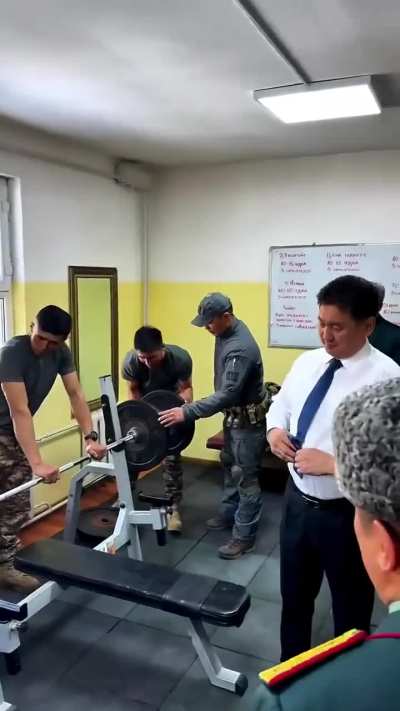 The President of Mongolia, 100 kg, bench presses 20 reps. This is just too badass!