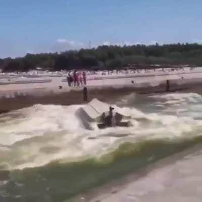 Boat diving into a wave