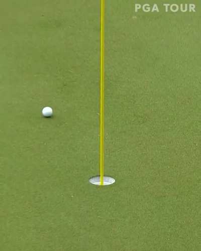 Sergio takes a divot on the green