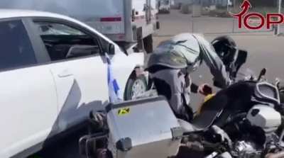 Driver tried to ram a guy with an Israeli flag on his motorcycle. Instead, he lost control and hit a truck.