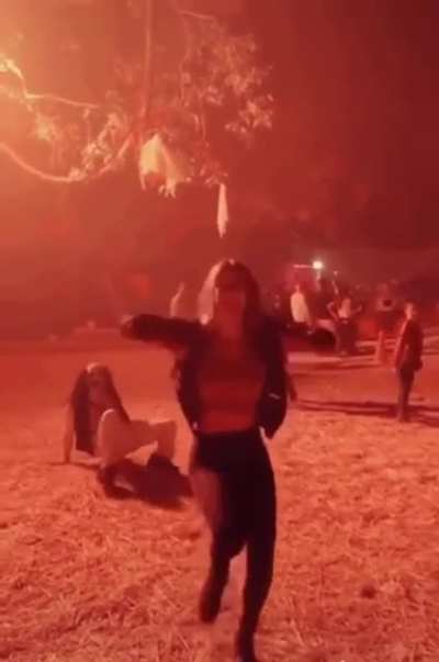 Dafuq is that creeping up behind her?