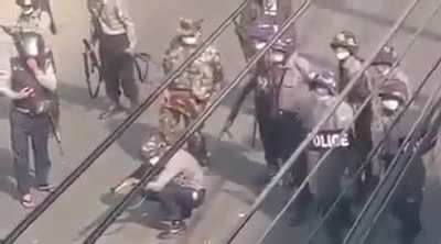 Myanmar Police shooting live rounds at protesters and cheering when they hit someone.