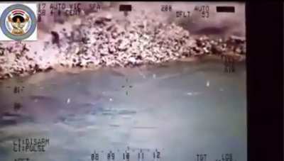 Isis members who were trying to flee from one side of Mosul meet with an Iraqi Air Force helicopter that obligates them before crossing the river, battle of Mosul-2017. [music from the source]