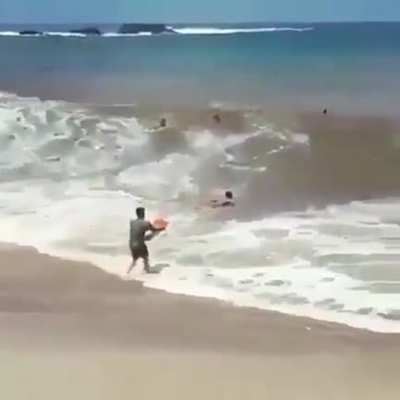 This guy attempting to go surfing but does not respect the power of the waves