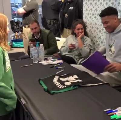 Girl meets her favorite basketball player & gives him drawings