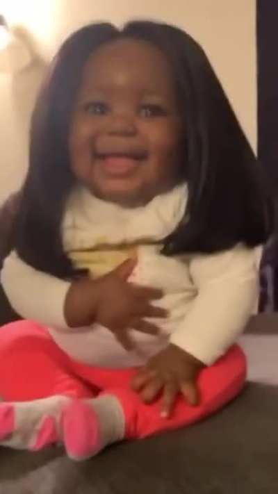 Baby wearing a wig