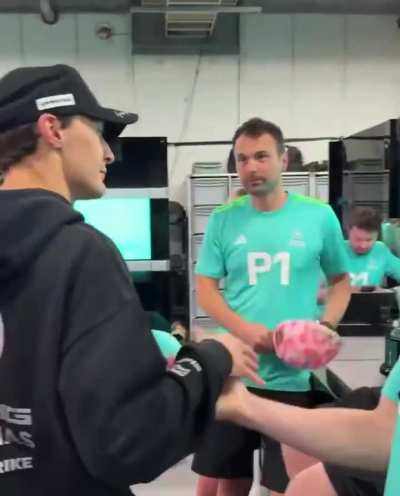 this one mechanic hiding the podium cap when he saw George (My eyes full of tears right now what the hell)