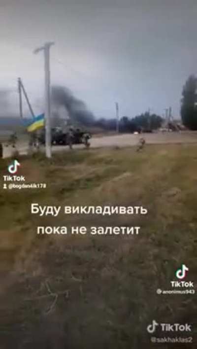 Ukrainian force advances down a road