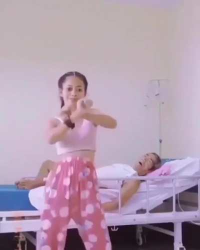 this girl cassually dances in front of her sick father like theres nothing going on......