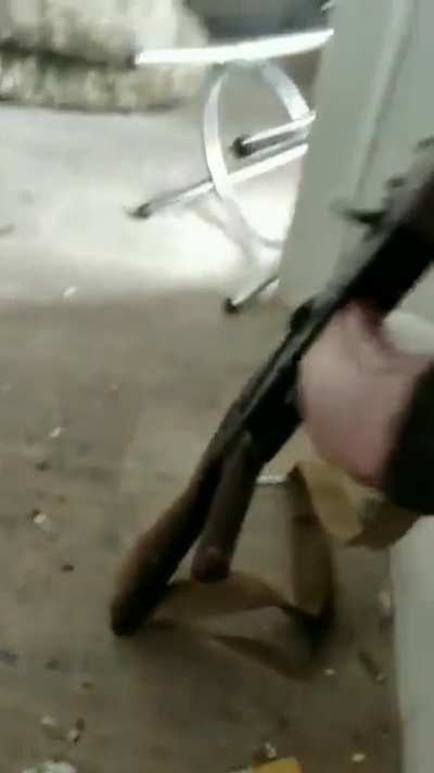 Ukrainian aerial reconnaissance team of the 93rd Motorized Brigade in Bakhmut during shelling. The drone operator tries to keep the remote as close to the window not to lose the connection with his drone