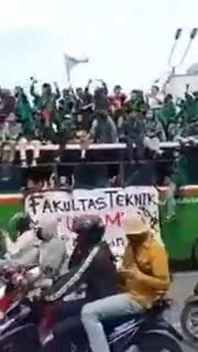 Thousands of enraged students and workers are staging new rallies across Indonesia in opposition to a law they say will cripple labor rights and harm the enviroment. The students choose this as the riot song