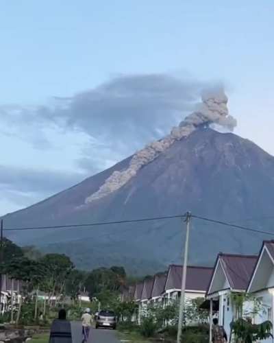 Lumajang Regency East Java Indonesia - March 20 2026 - Eruption observed at Mount Semeru stratovolcano with ash rising in the area