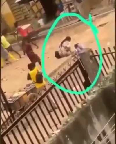 Looking at ongoing fight while walking with your child.